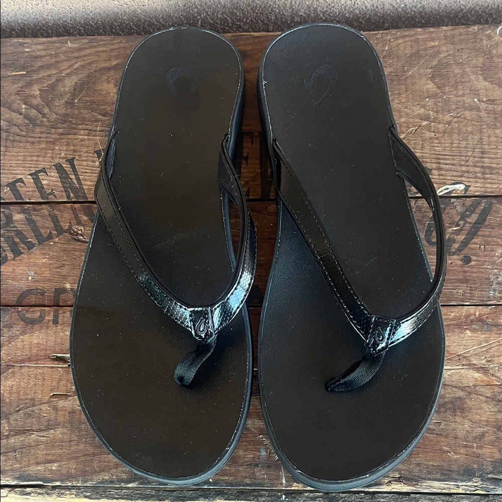 Olukai Black Flip Flops